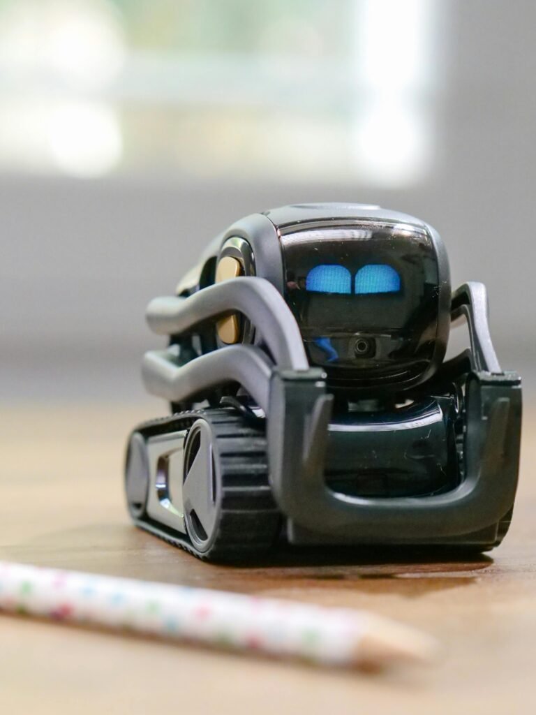 Explore the futuristic design of a miniature AI-powered robotic toy with modern technology elements.